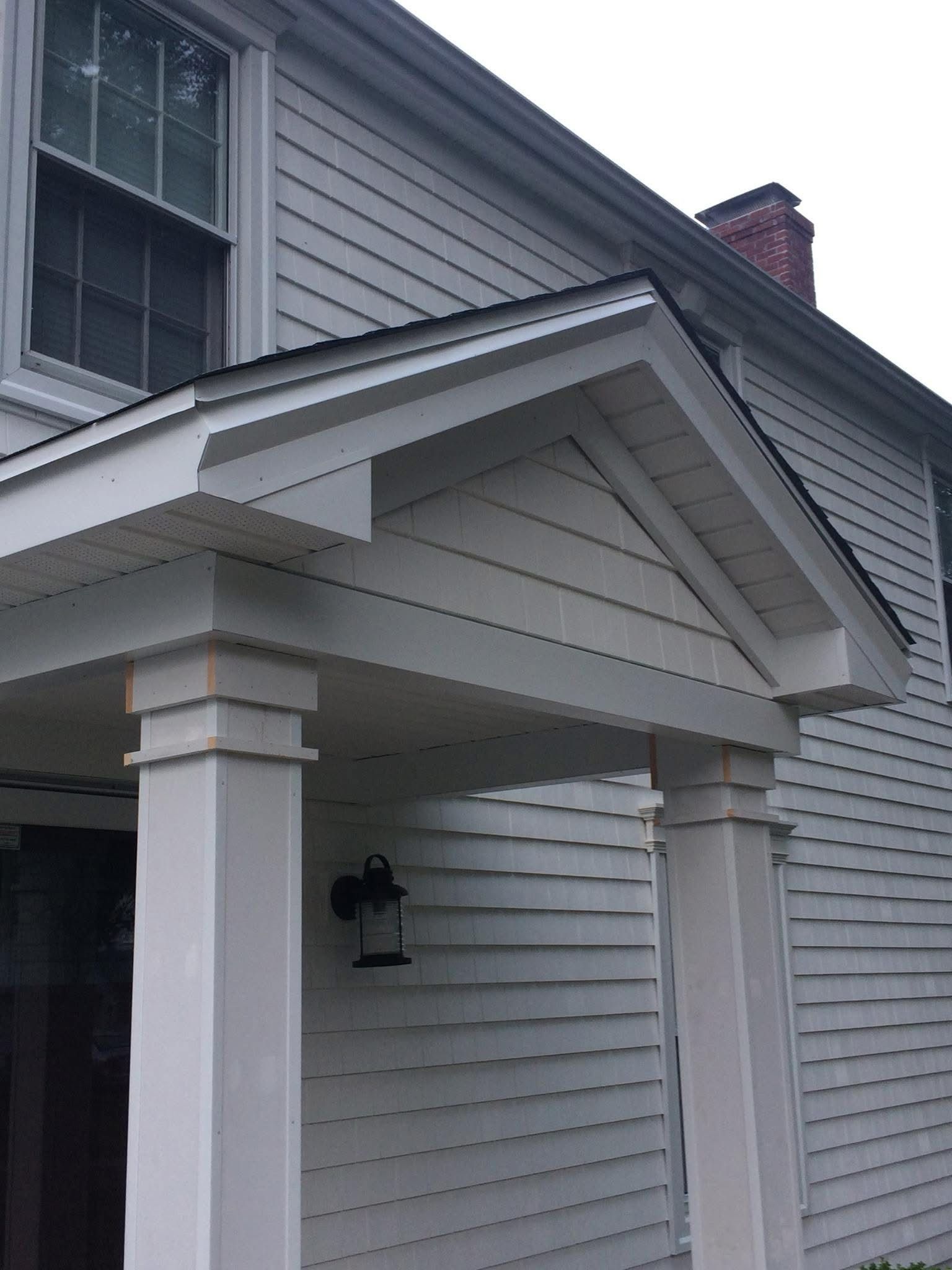 New seamless gutter and downspout on a home corner
