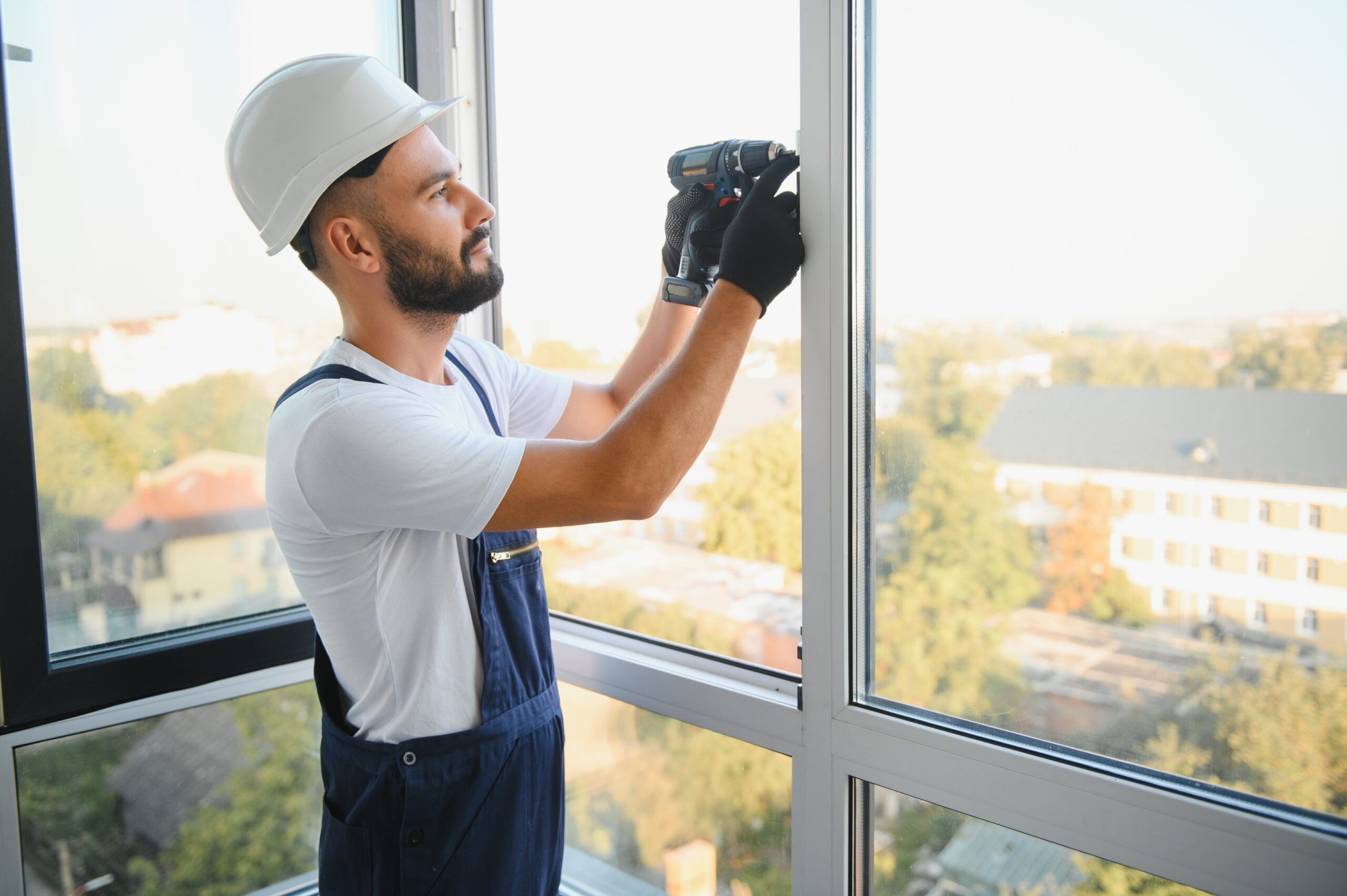 Installer fitting a new energy-efficient window